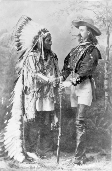 black and white image of buffalo bill cody with chief sitting bull on tour with the wild west show