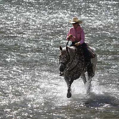 Rita Lovell on horseback in NW Wyoming